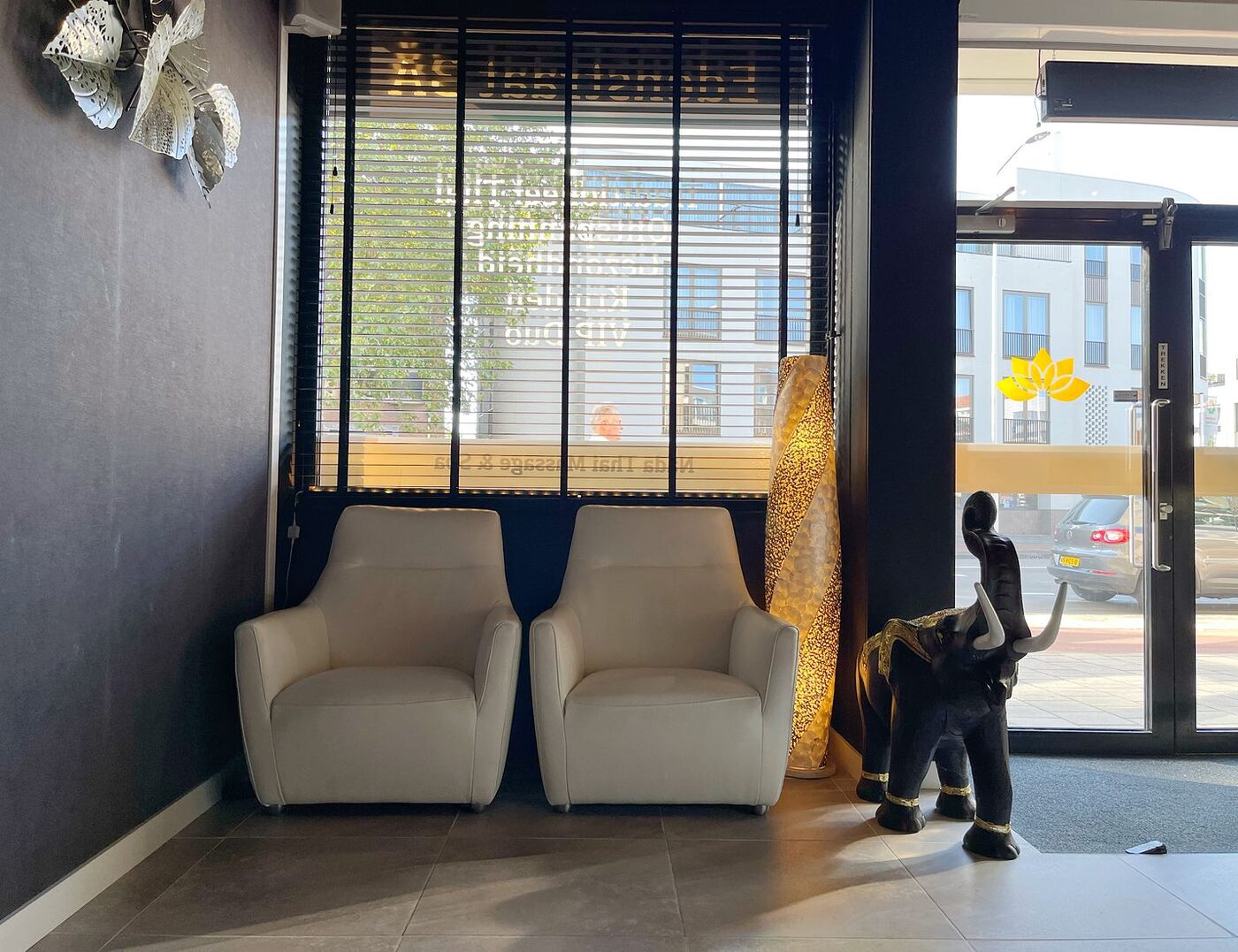 Reception desk with crystal chandelier, wooden wall and golden lotus medallion